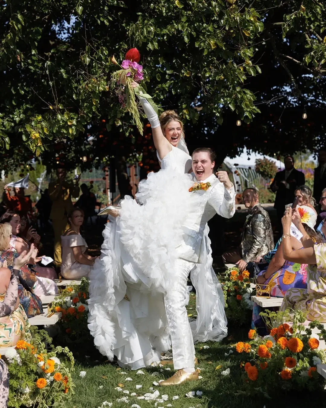 image shows a bride and husband smiling and laughing on their wedding day