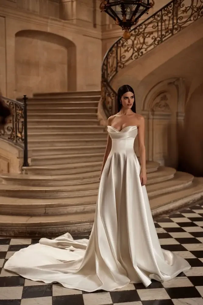 model is wearing a sleeveless ball gown