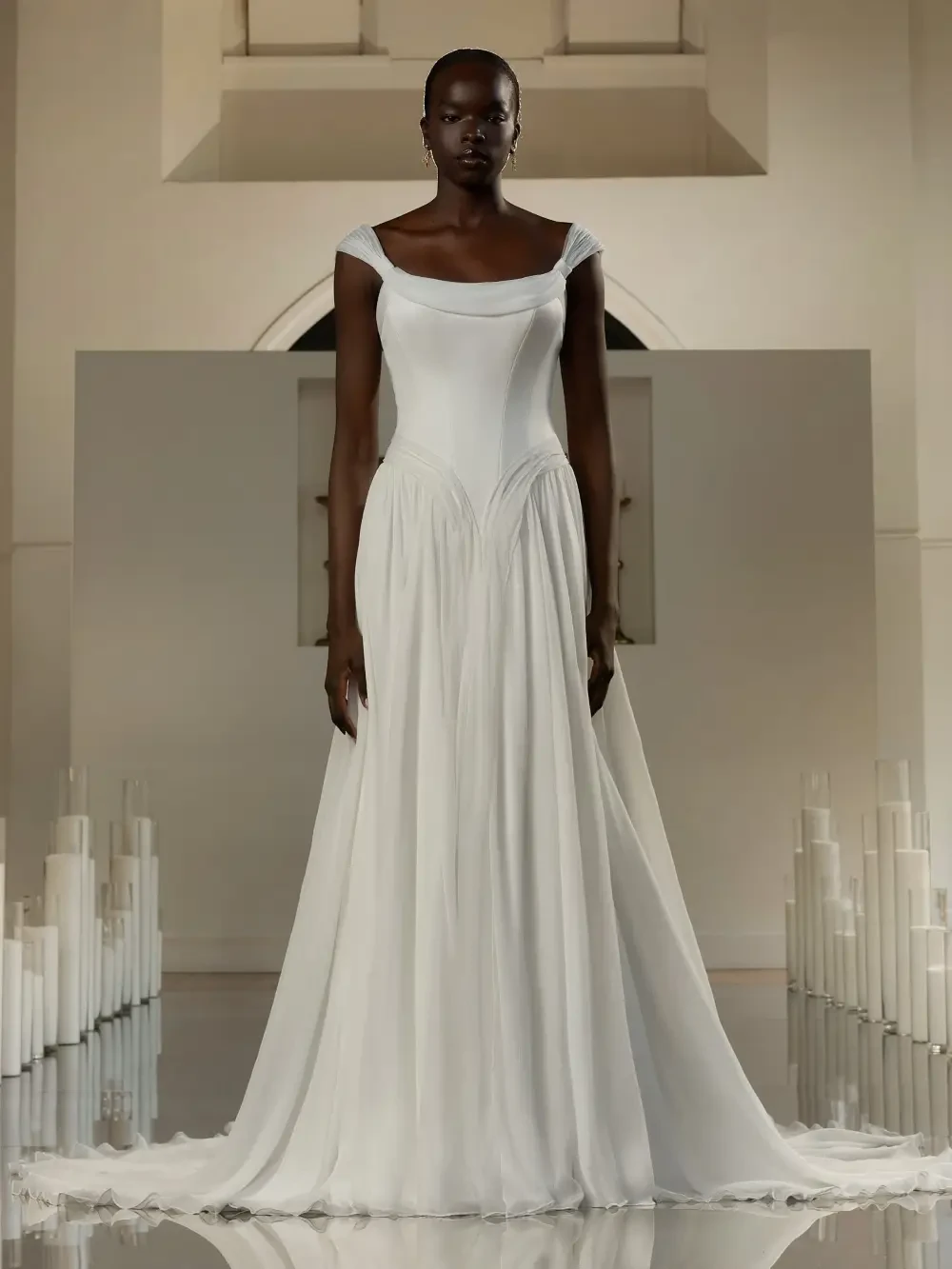 model is wearing a basque waist wedding dress