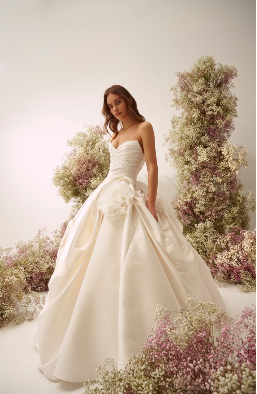 model is wearing a strapless bridal gown